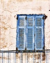 Old, weathered blue wooden window shutter Royalty Free Stock Photo