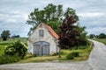 Old brick shed next to a small country road in Valleberga, Sweden.