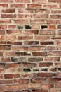 Old weathered brick wall with colors and shapes and signs of repair Royalty Free Stock Photo