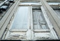 Old, weathered, broken window with peeling paint, abandoned building in Porto, Portugal Royalty Free Stock Photo