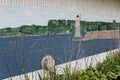 Old exterior wall of building painted with scenes of Lake Erie and Dunkirk Lighthouse, New York, 2018 Royalty Free Stock Photo