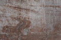 Old weathered discoloured veneer surface painted in brown color. Wood texture. Vintage background.
