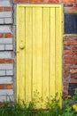 Old weathered door with knob.