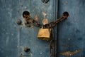 Old weathered door locked with a padlock and a rusty chain Royalty Free Stock Photo