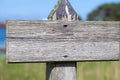 Weathered empty wooden outdoor signpost