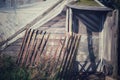 Old weathered entrance to a handmade greenhouse.