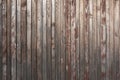 Old weathered faded barn wall made from vertically oriented wood planks. Vintage rustic timber background. Lumber texture Royalty Free Stock Photo