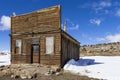 Old weathered Ghost Town buildings in the desert during winter with snow. Royalty Free Stock Photo