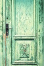 Old and weathered green door