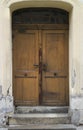 Old weathered, grunge and damaged wooden house entrance door Royalty Free Stock Photo