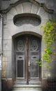 Old weathered, grunge, spooky and damaged wooden house entrance door Royalty Free Stock Photo