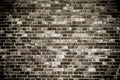 Old and weathered grungy black dark gray concrete block brick wall surface texture dark background Royalty Free Stock Photo