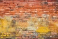 Old and weathered grungy yellow and red brick wall as seamless pattern texture background