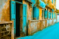 Old weathered House with yellow wall and brick and open green pastel window. architecture, classic home Royalty Free Stock Photo