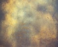 Abstract background, old metalic plate with golden paint on surface. Royalty Free Stock Photo