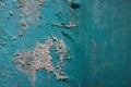 Old weathered painted wall background texture. Green dirty peeled plaster wall with falling off flakes of paint.Peeling paint Royalty Free Stock Photo