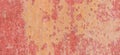 Old weathered painted wall background texture. Red dirty peeled plaster wall with falling off flakes of paint. Royalty Free Stock Photo