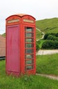 Old weathered phonebox at the coast