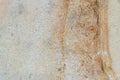 Old weathered plaster coated wall texture with shades of grey and orange