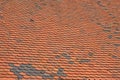 Old weathered red brown ceramic roof tiles Royalty Free Stock Photo