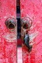 Old weathered red painted wooden door chinese traditional style. Royalty Free Stock Photo