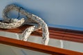 Old weathered rope lying on side of boat