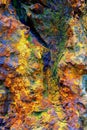 Old weathered and textured colorful rock background