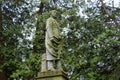 Old weathered gravestone with statue of soldier in historic cemetery, Saratoga Monument and Victory Woods, New York, 2019