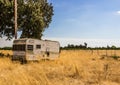 Old Abandoned Trailer In Open Field