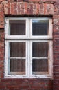 Old weathered window in brick wall Royalty Free Stock Photo