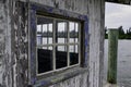 Old weathered window on a shack on a florida waterway Royalty Free Stock Photo