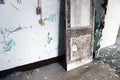 Old weathered wooden cabinet with peeling paint at abandoned school building Royalty Free Stock Photo