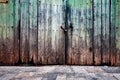 Old weathered wooden closed door. Royalty Free Stock Photo