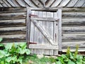 Old weathered wooden farm barn door Royalty Free Stock Photo