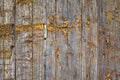 Old weathered wooden fence covered with yellow paint flakes . Rustic style wood texture Royalty Free Stock Photo