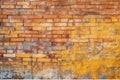 Old and weathered yellow and red brick wall, seamless pattern backdrop.