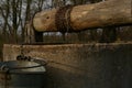 Old well, bucket and string. Royalty Free Stock Photo