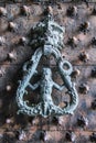 Old well decorated iron door handle with marine elements