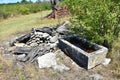 Old well and drinking trough for livestock