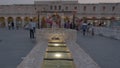 The Old Well Fountain in Souq Waqif , Doha, Qatar with pigeons flying and people walking