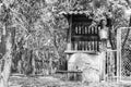 Old well with iron bucket on long forged chain for clean drinking water Royalty Free Stock Photo