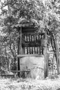 Old well with iron bucket on long forged chain for clean drinking water Royalty Free Stock Photo