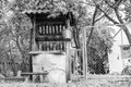 Old well with iron bucket on long forged chain for clean drinking water Royalty Free Stock Photo