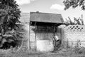 Old well with iron bucket on long forged chain for clean drinking water Royalty Free Stock Photo