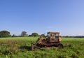 An old and well used Caterpillar Bulldozer parked in a Farm Field near to Letham Village in Angus.