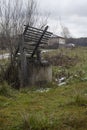 Old well with wooden roof. Old abandoned well with wooden roof Royalty Free Stock Photo