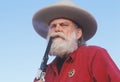 Old West gunslinger drawing guns during historical reenactment, CA