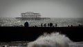 The old West Pier of Brighton, England, UK with the silhouette of donut groyne Royalty Free Stock Photo