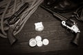 Old western revolver guns with U.S. Marshal badge and silver dollars with hat, rope and cowboy boots Royalty Free Stock Photo