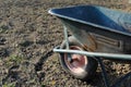 Old wheel barrow over soil